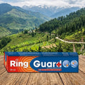 Box of Ring Guard+ on a wooden surface with a scenic mountain landscape in the background