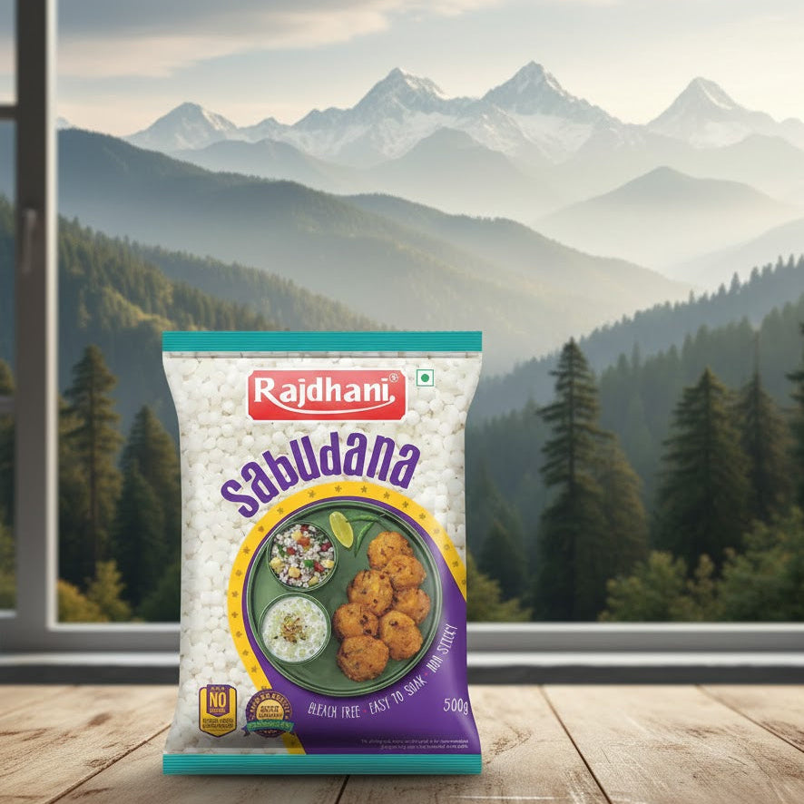 Rajdhani Sabudana package on a wooden table with a mountainous landscape in the background