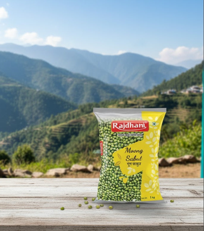 Rajdhani Moong Sabut package on a wooden surface with a mountainous landscape in the background