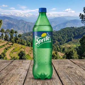 Sprite bottle on a wooden surface with a scenic mountain background