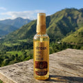Streax Shine Hair Serum bottle on a wooden surface with a mountainous landscape in the background