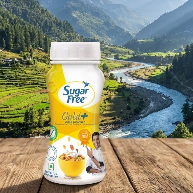 Sugar Free Gold+ container on a wooden surface with a scenic mountain landscape in the background