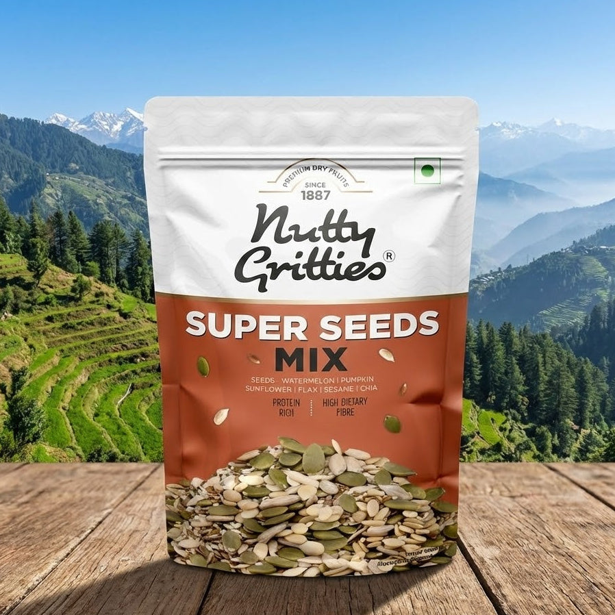 Bag of Nutty Gritties Super Seeds Mix with a mountainous landscape in the background