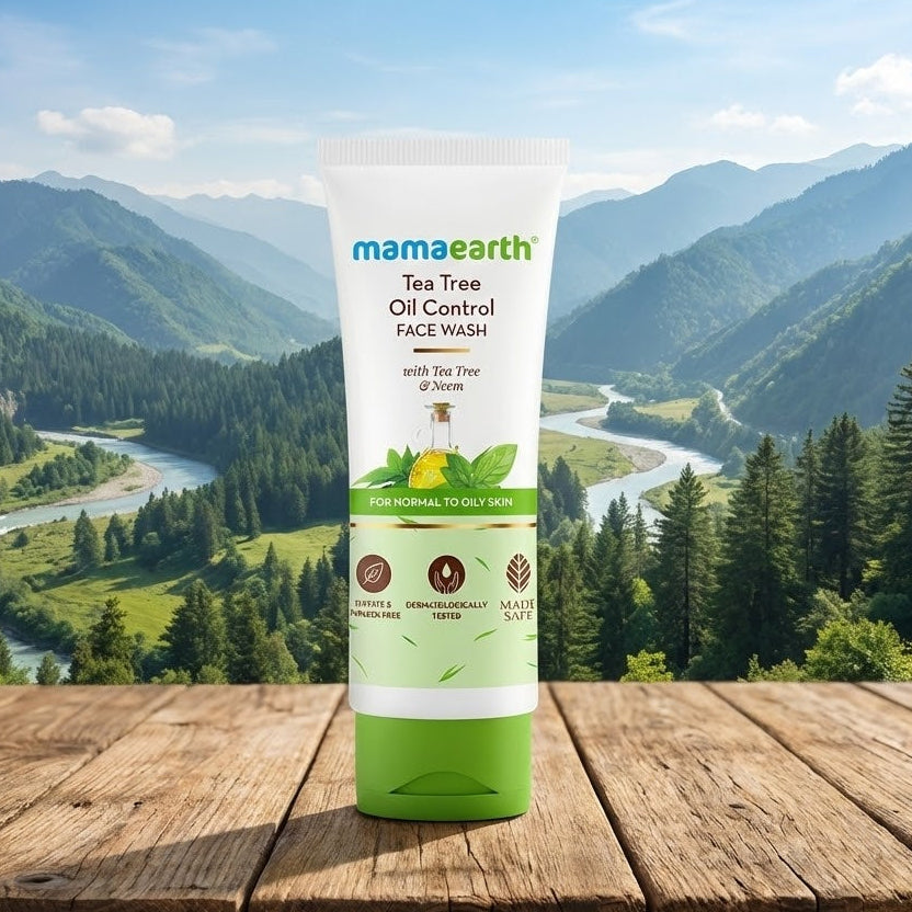 Mamaearth Tea Tree Oil Control Face Wash tube with a scenic mountain background