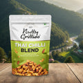 Packaging of Nutty Gritties Thai Chilli Blend against a scenic mountain backdrop