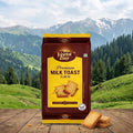 Veeta Day Premium Milk Toast Elaichi package with a scenic mountain background