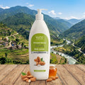 VLCC Almond Honey body lotion on a wooden surface with a scenic mountain background