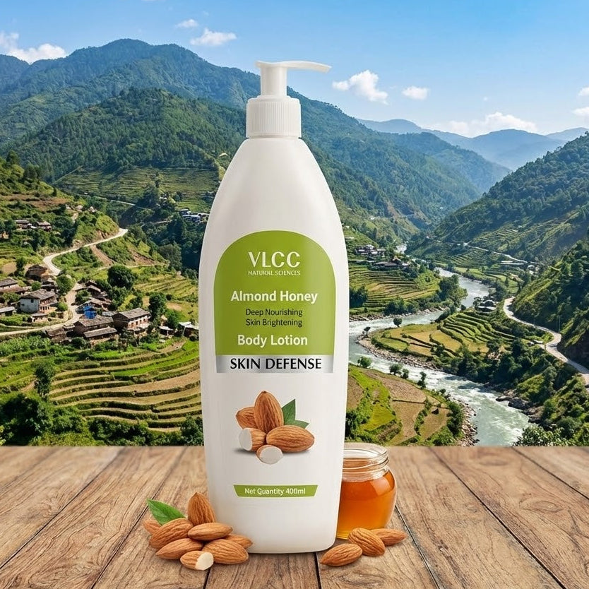 VLCC Almond Honey body lotion on a wooden surface with a scenic mountain background