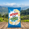 Active Wheel 2in1 laundry detergent packet with a scenic mountain background